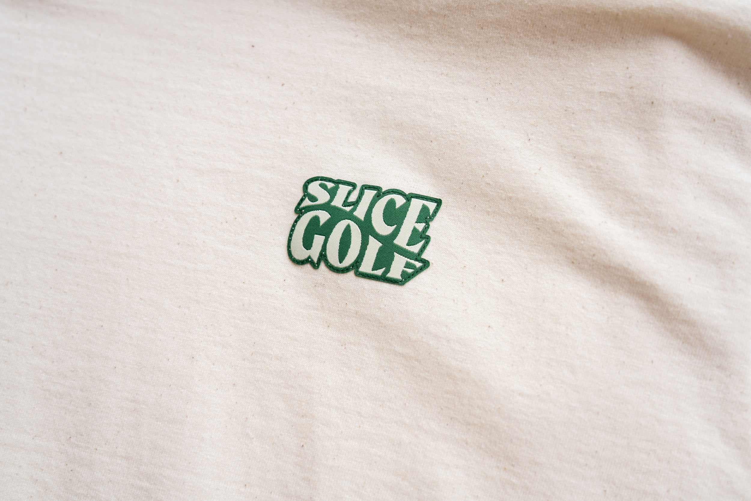 Golf T-shirt in off-white with Slice Golf Logo on left chest
