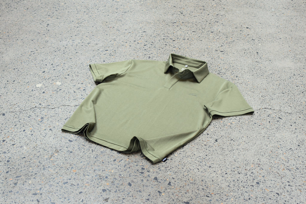 Model wearing The Narooma Polo in olive green
