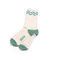 Golf sports socks in off-white and green with green wavy lines.